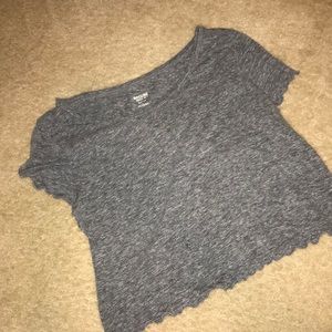 Grey T-shirt with rippled edging. Crop top like